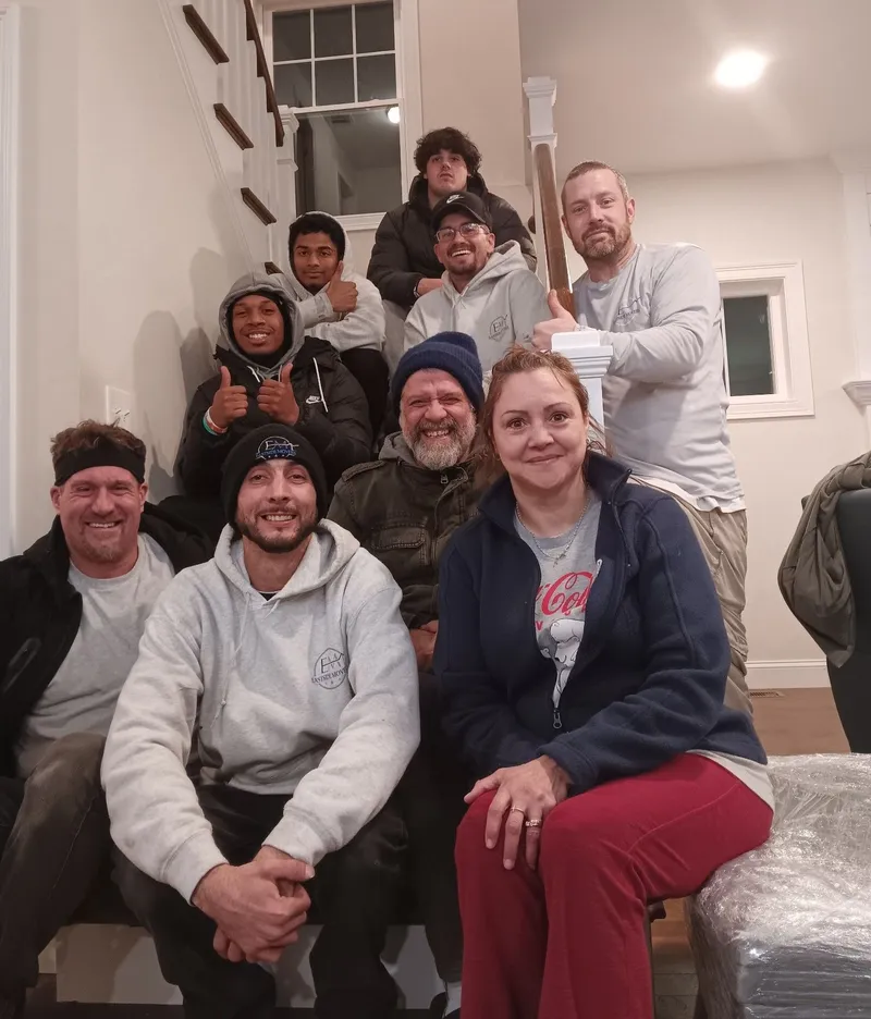 Eastside Movers crew reviewing moving agreement with customer in Needham